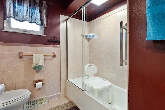 1479 Devonhurst Dr, Columbus, OH 43232 - bathroom with tile patterned flooring and bath / shower combo with glass door