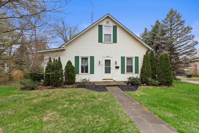 bungalow-style house with a front lawn