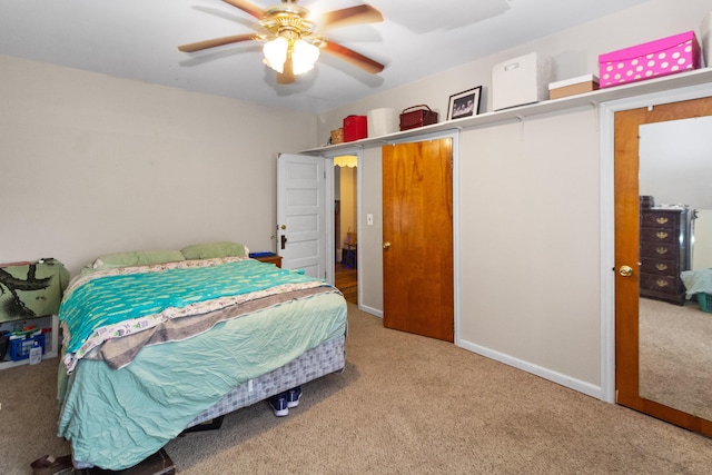 carpeted bedroom with a ceiling fan