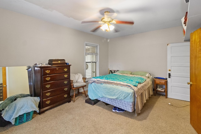 carpeted bedroom featuring a ceiling fan