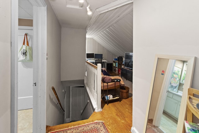 interior space with vaulted ceiling and wood finished floors