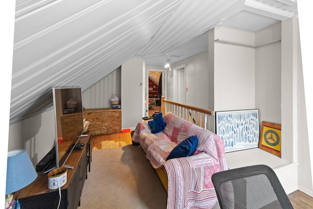 interior space featuring lofted ceiling and wood finished floors