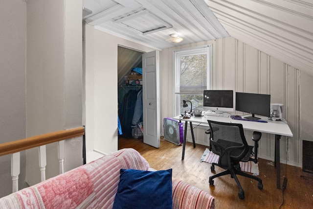 office space featuring vaulted ceiling and wood finished floors