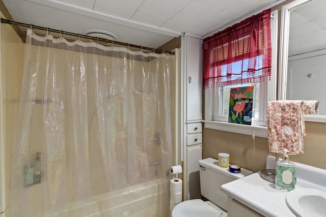bathroom featuring shower / tub combo, toilet, and vanity