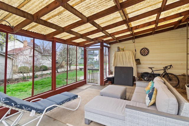 sunroom with an outdoor living space