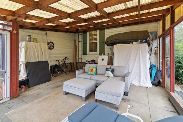 sunroom / solarium featuring an outdoor hangout area