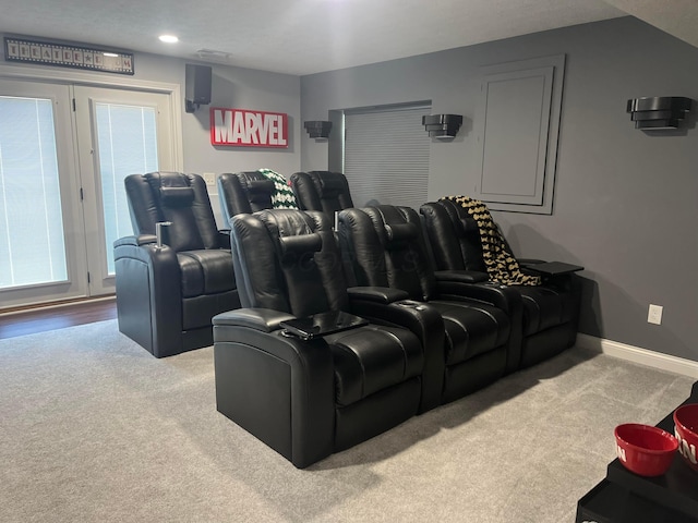 carpeted cinema with recessed lighting and baseboards