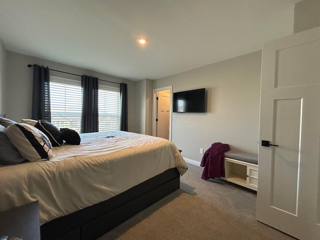 bedroom featuring recessed lighting, carpet floors, and baseboards