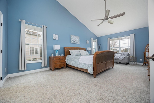 carpeted bedroom featuring baseboards, high vaulted ceiling, and ceiling fan