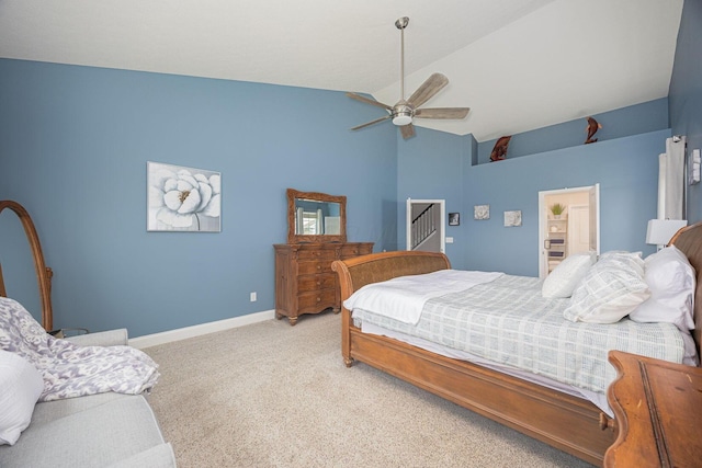 carpeted bedroom with a ceiling fan, baseboards, and high vaulted ceiling