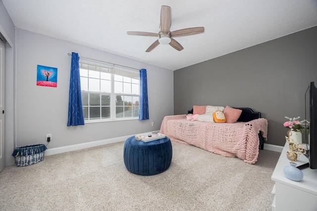 carpeted bedroom with baseboards and a ceiling fan
