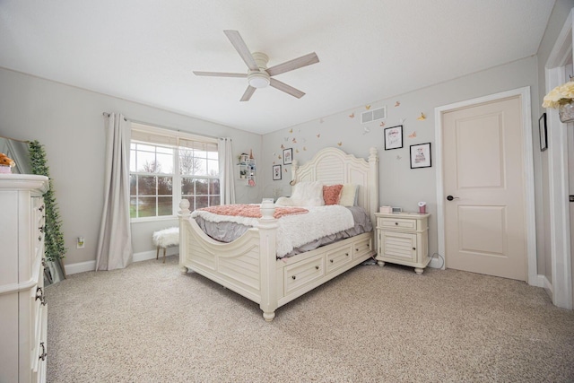bedroom with baseboards, visible vents, a ceiling fan, and light colored carpet
