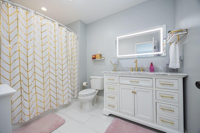 full bath with a shower with curtain, vanity, tile patterned flooring, and toilet