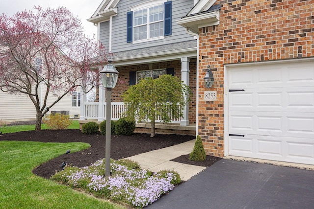 doorway to property with brick siding