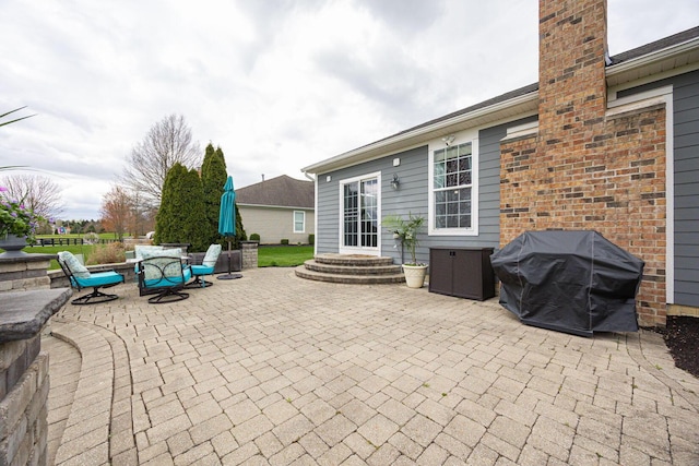 view of patio / terrace with outdoor dining area and a grill