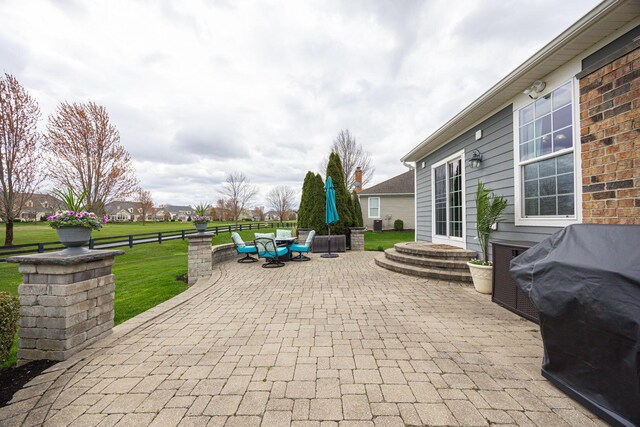 view of patio / terrace featuring fence and an outdoor living space