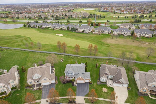 birds eye view of property featuring a residential view, a water view, and view of golf course