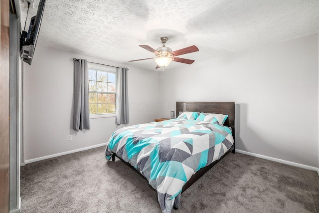 bedroom with baseboards, a ceiling fan, carpet flooring, and a textured ceiling
