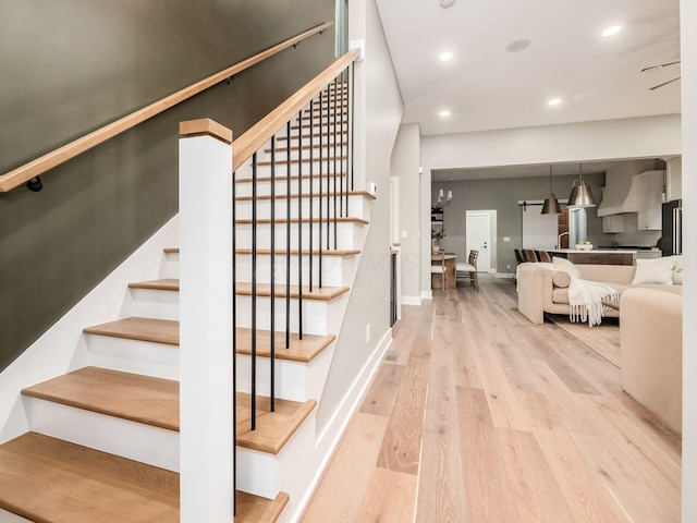 496 W 1st Ave, Columbus, OH 43201 - staircase featuring wood finished floors, recessed lighting, and baseboards
