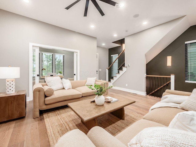 496 W 1st Ave, Columbus, OH 43201 - living room featuring light wood-type flooring, ceiling fan, recessed lighting, baseboards, and stairway