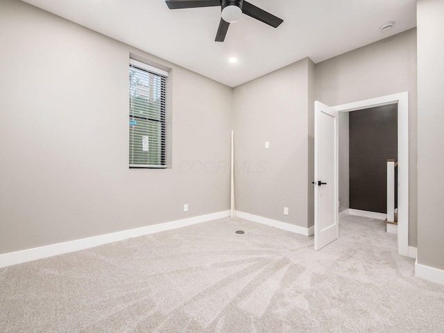496 W 1st Ave, Columbus, OH 43201 - spare room with light carpet, a ceiling fan, baseboards, and a smoke detector