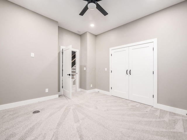 496 W 1st Ave, Columbus, OH 43201 - unfurnished bedroom featuring light colored carpet, baseboards, a ceiling fan, a closet, and recessed lighting