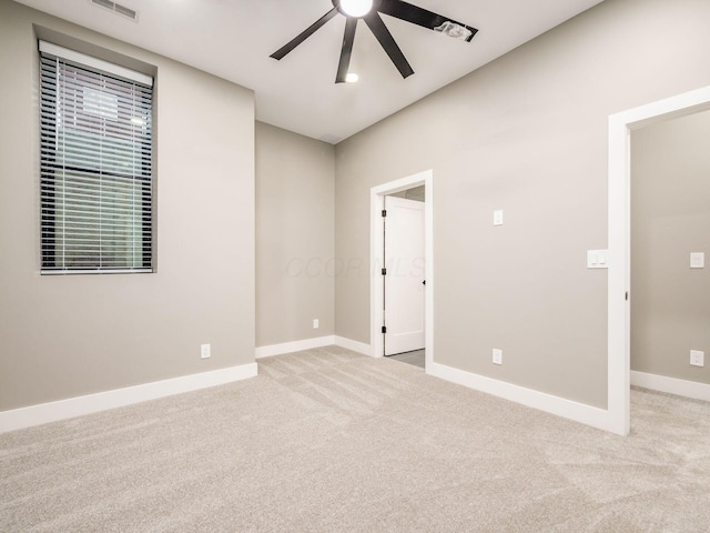 496 W 1st Ave, Columbus, OH 43201 - unfurnished room featuring a ceiling fan, light colored carpet, and baseboards