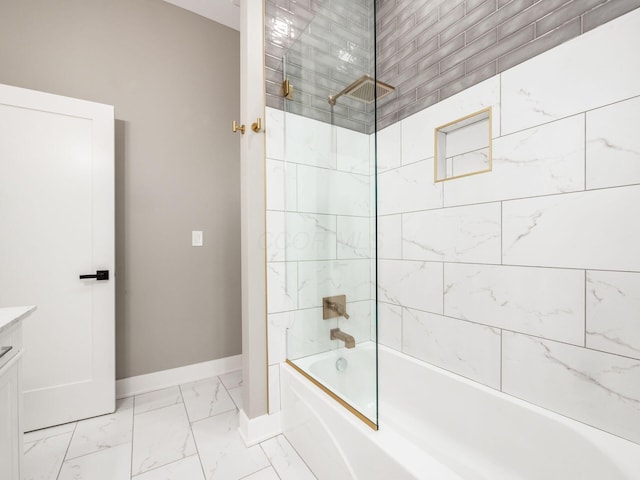 496 W 1st Ave, Columbus, OH 43201 - bathroom featuring baseboards, marble look tiles, tub / shower combination, and vanity