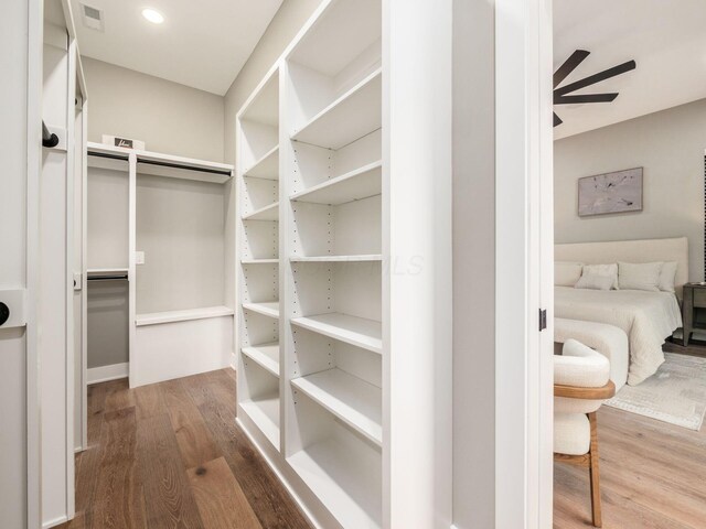 496 W 1st Ave, Columbus, OH 43201 - walk in closet with ceiling fan and wood finished floors