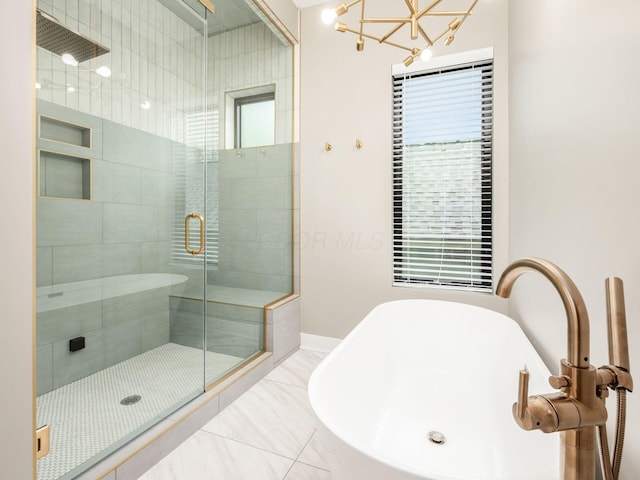 496 W 1st Ave, Columbus, OH 43201 - full bath with a freestanding tub, a stall shower, a sink, marble finish flooring, and baseboards
