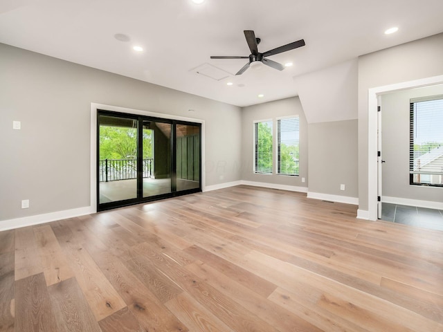 496 W 1st Ave, Columbus, OH 43201 - unfurnished living room with light wood-type flooring, baseboards, ceiling fan, and recessed lighting