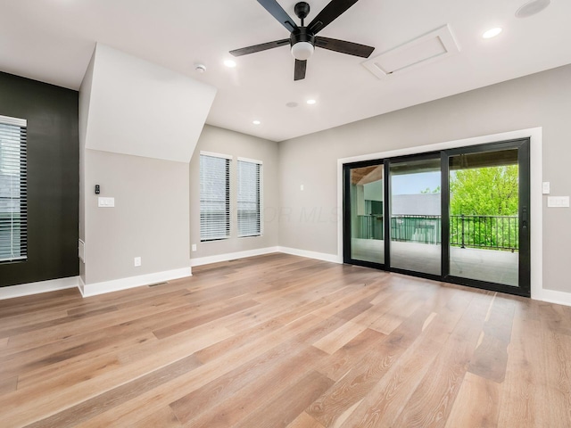 496 W 1st Ave, Columbus, OH 43201 - spare room with attic access, light wood finished floors, healthy amount of natural light, and recessed lighting