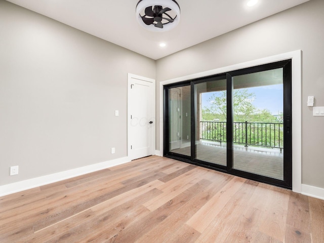 496 W 1st Ave, Columbus, OH 43201 - unfurnished room with light wood-style floors, baseboards, and recessed lighting