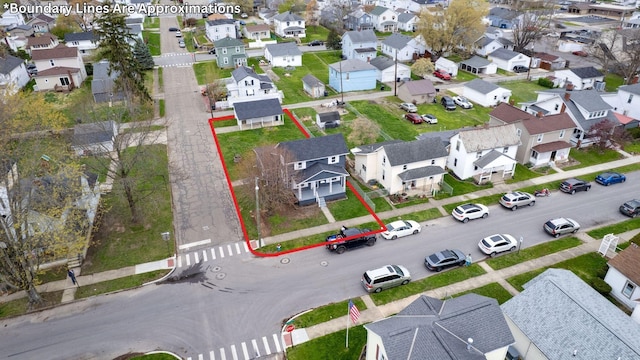 birds eye view of property with a residential view