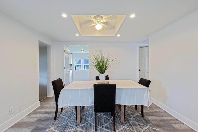 dining room with baseboards, a ceiling fan, wood finished floors, and recessed lighting