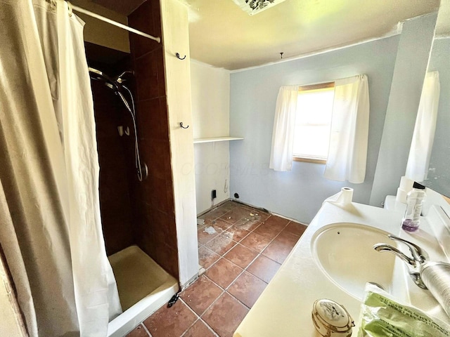 full bath with tile patterned flooring, vanity, and a stall shower
