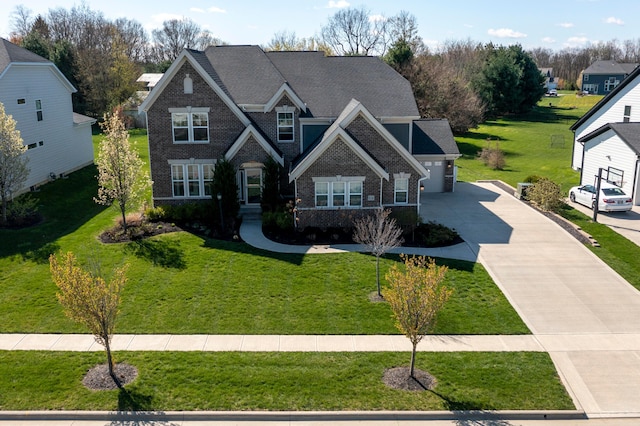 816 Kelburn Ln, Pickerington, OH 43147 - craftsman-style home featuring a front lawn, driveway, brick siding, a garage, and a shingled roof