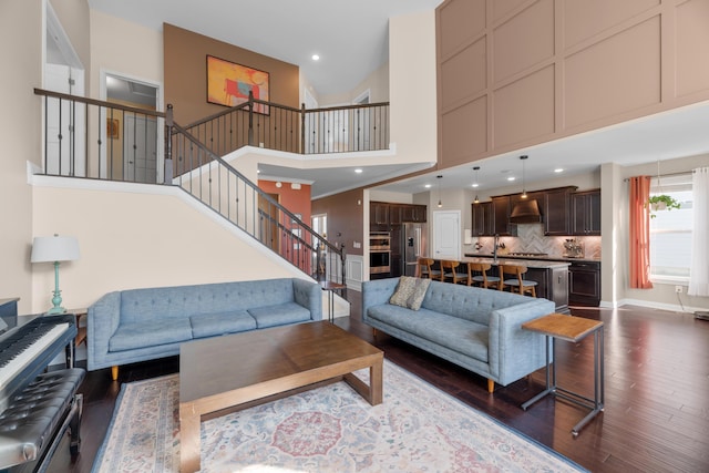 816 Kelburn Ln, Pickerington, OH 43147 - living room with stairway, a towering ceiling, baseboards, dark wood-style floors, and recessed lighting
