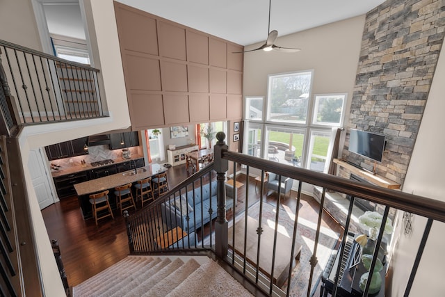 816 Kelburn Ln, Pickerington, OH 43147 - stairway featuring a towering ceiling, wood finished floors, and ceiling fan