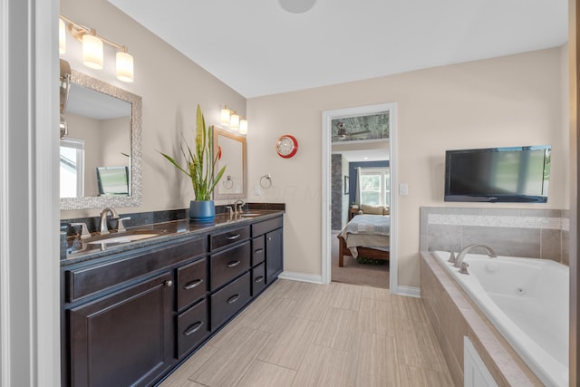 816 Kelburn Ln, Pickerington, OH 43147 - full bathroom featuring double vanity, a jetted tub, connected bathroom, and a sink