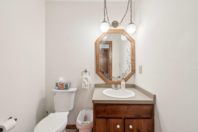 bathroom with toilet and vanity