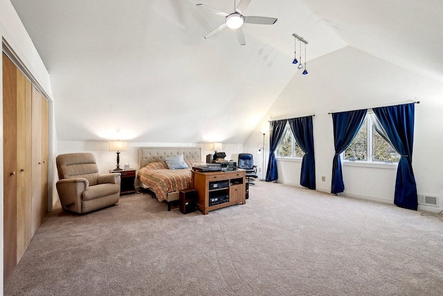 bedroom with light carpet, visible vents, lofted ceiling, a ceiling fan, and a closet