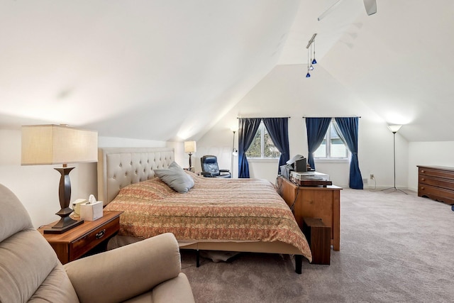 carpeted bedroom featuring vaulted ceiling