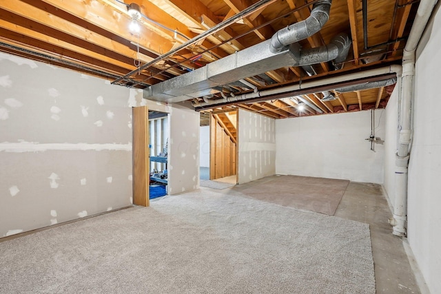 unfinished basement featuring stairs