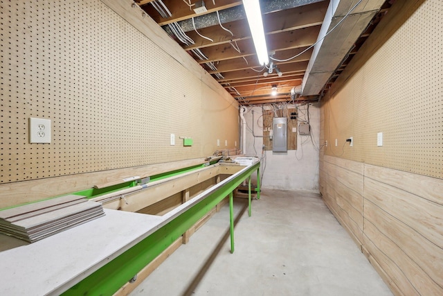 unfinished basement featuring electric panel