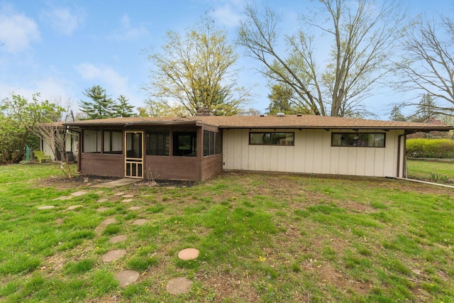 3434 Fishinger Rd, Columbus, OH 43221 - back of house featuring a lawn and a sunroom