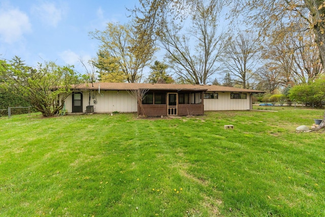 3434 Fishinger Rd, Columbus, OH 43221 - rear view of house with a yard, a sunroom, a chimney, and fence