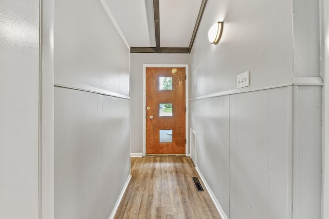 3434 Fishinger Rd, Columbus, OH 43221 - doorway to outside featuring a decorative wall, wood finished floors, visible vents, and wainscoting