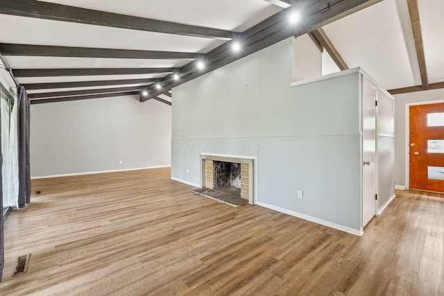 3434 Fishinger Rd, Columbus, OH 43221 - unfurnished living room with a fireplace, wood finished floors, vaulted ceiling with beams, and baseboards