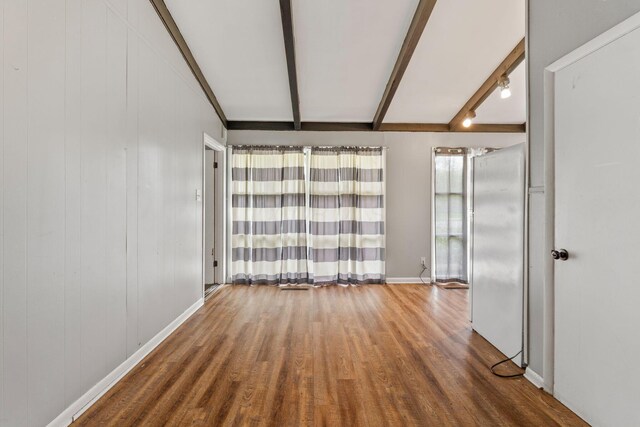 3434 Fishinger Rd, Columbus, OH 43221 - unfurnished room with baseboards, wood finished floors, and beam ceiling